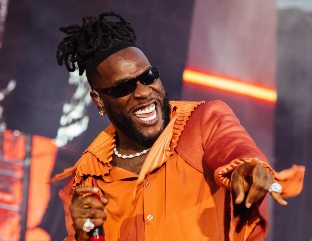 Burna Boy's Grammy performance with Brandy and 21 Savage, showcasing the vibrant and historic moment on stage.