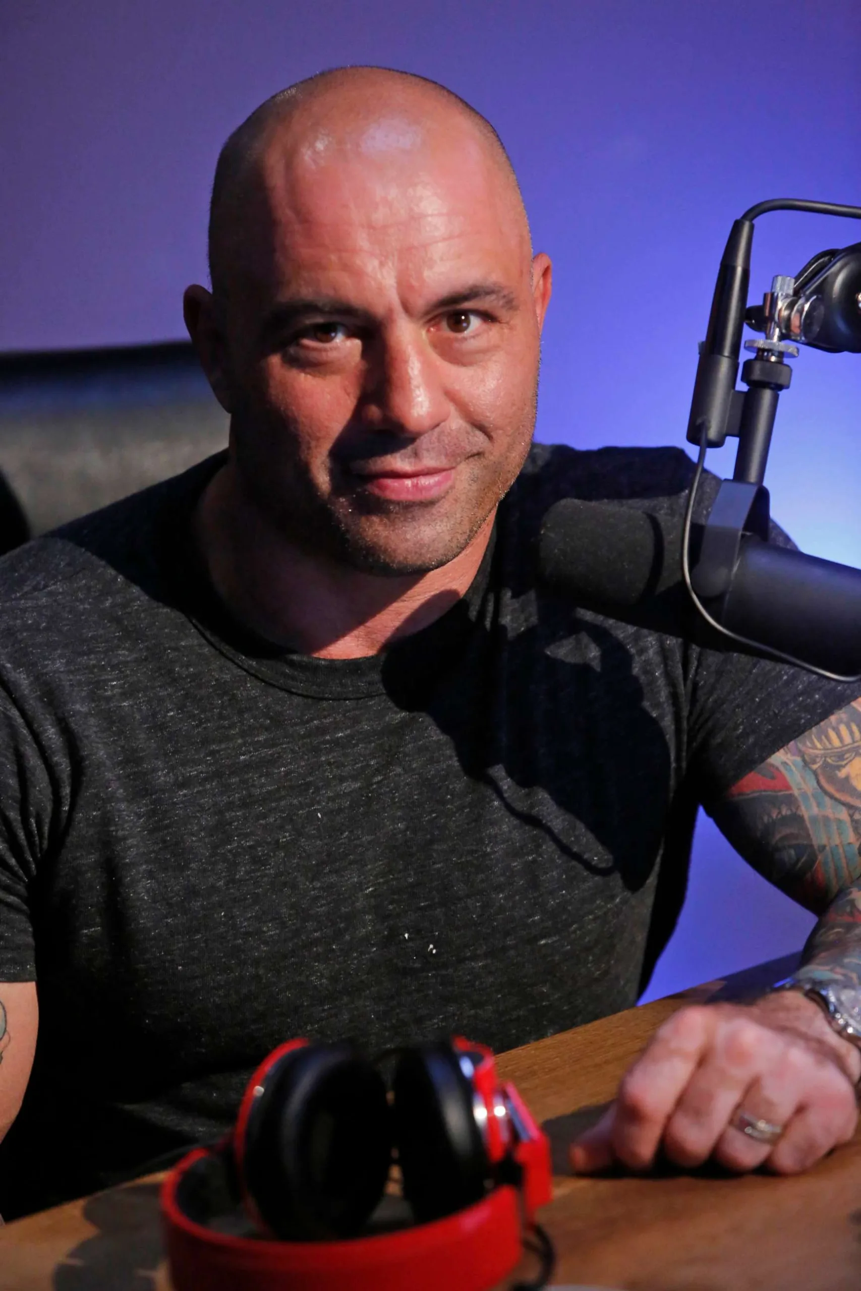 The Joe Rogan Experience" podcast, Joe Rogan in conversation with various guests, the Spotify logo, and scenes from the Green Room playlist, creating a visual narrative of the podcast's evolution and Spotify's strategic shift.