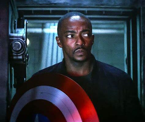 Anthony Mackie as Captain America holding the iconic shield in a scene from "Captain America: Brave New World."