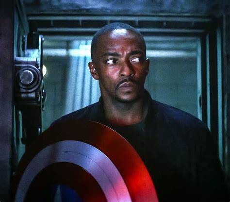Anthony Mackie as Captain America holding the iconic shield in a scene from "Captain America: Brave New World."